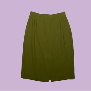 Woman’s Green short skirt lined w/ green 100% acetate, 100% sustainably sourced.